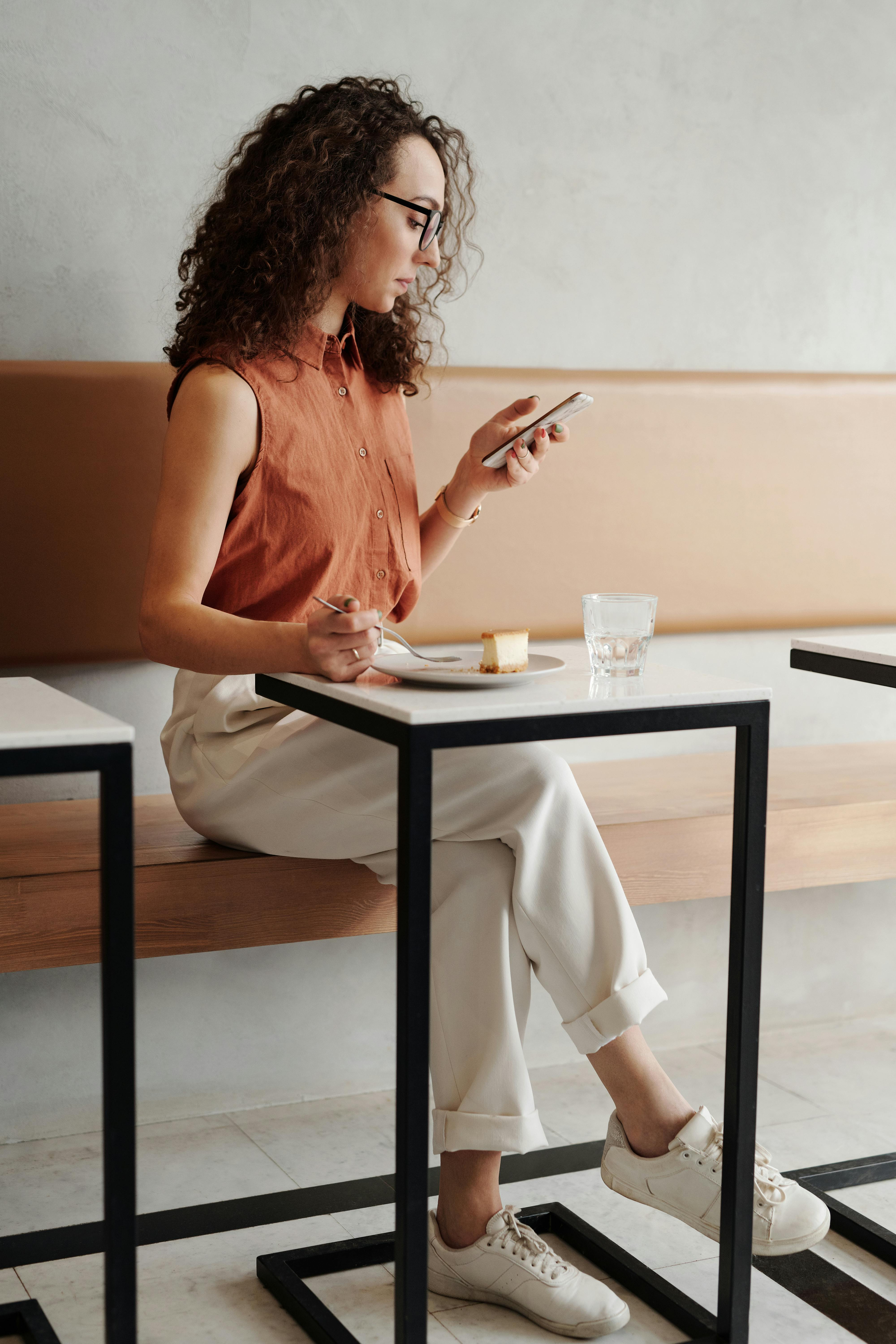 Woman Accessing Social Media on Phone